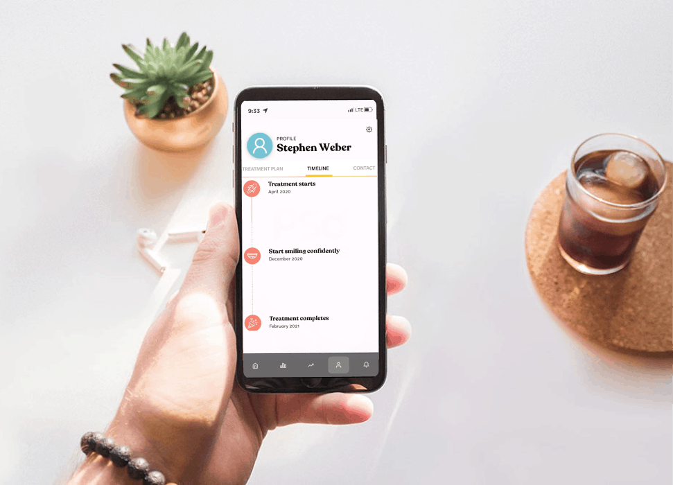 Female hands holding phone with app tracking FXOntrack | OrthoFx